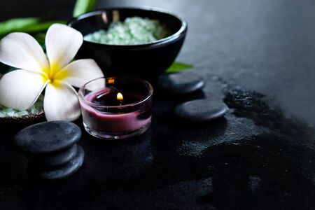 Thai Spa.  Top view of white Plumeria flower setting for massage treatment and relax on concrete...