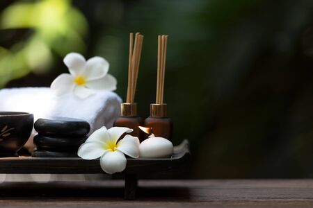 Thai spa composition treatments aromatherapy with candles and Plumeria flowers. Healthy and Relax...