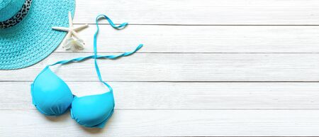 Summer items fashion woman swimsuit Bikini, starfish and sunblock. Travel and vacations in the...
