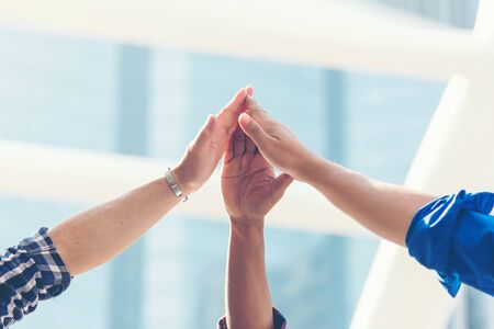 Architect engineer team stack hands join together and success in construction city site after...