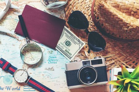 Traveler accessories and items man with tourism backpack and visiting for planning trips travel destination and vacations on the world, top view. Travel and Summer holiday concept の写真素材