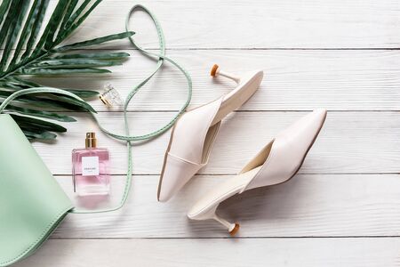 Fashion bag and shoe woman accessories background. Trendy fashion luxury handbag , heels shoe, perfume and cosmetic design. Lifestyle and Beauty Conceptの写真素材
