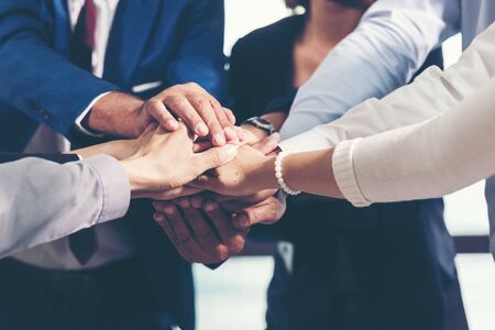 Partners Team work joining hands to success together. Business Team stack of hands for star up...