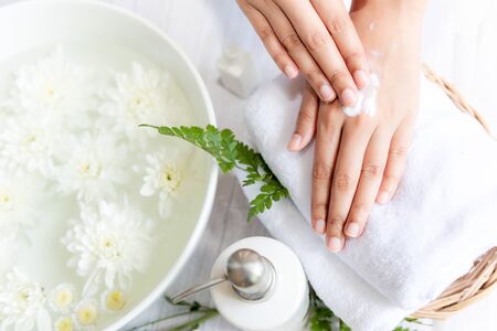 Spa beauty massage health wellness.  Spa Thai therapy treatment aromatherapy for nail and hands woman with white flower nature candle for relax and summer time.Â  Lifestyle and cosmetic Conceptの写真素材