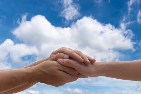 People woman and man holding hands to together take care and help tenderness protection