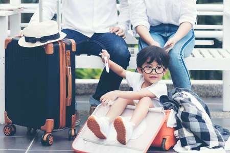Happy family planning travel in summer vacation. Asia youngÂ people lifestyle packing bag luggage and enjoy fun and relax leisure destination in holiday. Travel and Family Conceptの写真素材
