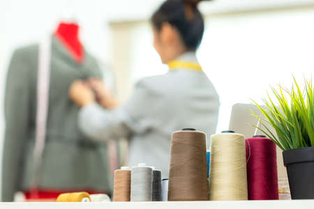 Close up items and equipment material for work designer in the showroom. Mannequin stylish tailor and measurements background.  Business small Conceptの写真素材