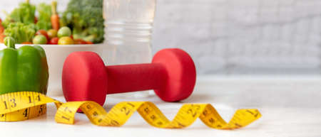 Diet and Healthy life loss weight exercise Concept. Green apple and Weight scale measure tap with...