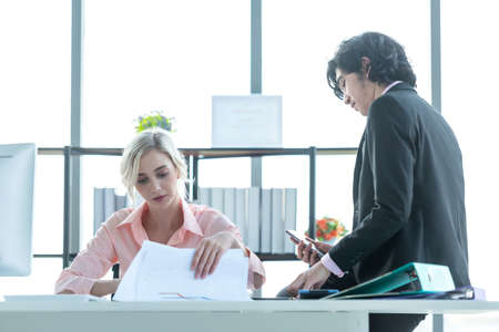 Business partners training and discussing contract and graph of financial report development, new project investment business job. Team work partners meeting and brief work in the office room.  Business Conceptの写真素材