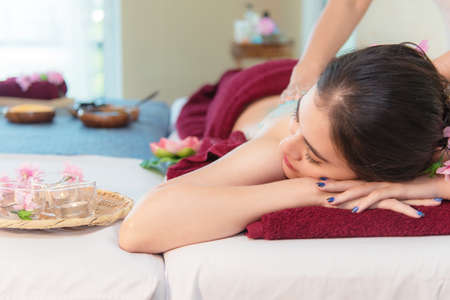 Woman spa body treatment and massage aroma therapy product relax and healthy and beauty. Masseur doing massage Thai spa and scrub.  Healthy Conceptの写真素材