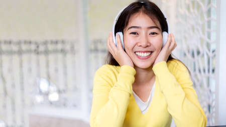 Inspired young asian woman listening the music at home.  people smiling relax and happy life....