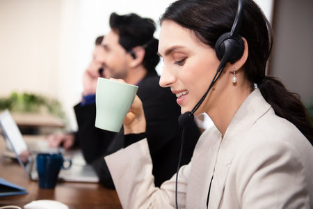Call center and customer service team support for information operator at work.Â  People woman employee consultant and talking on hands free phone for help and service customer.の写真素材