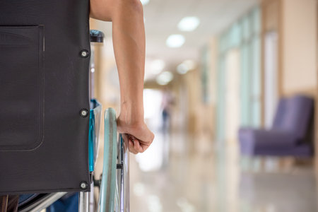 Close up hand  people with Wheelchairs waiting of patient services. Medical Wheelchairs in the hospital.の写真素材