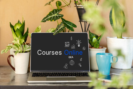 Course Online text on laptop screen on table with plant and coffee cup in the nature garden at home. Technology and Education Conceptの写真素材