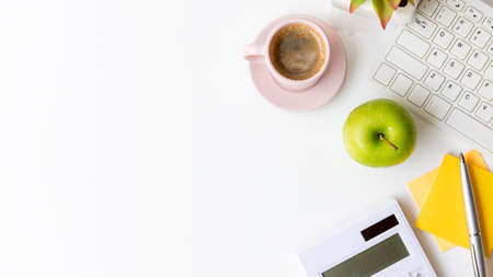 Healthy snack and lunch with working in office.  Top view Green apple with back coffee pink cup for diet Health on white table working.  Healthy Lifestyle Conceptの写真素材
