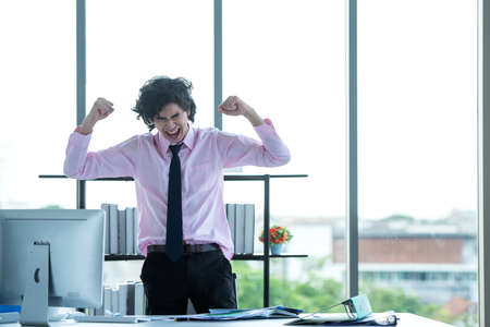 Relax time.  Successful Businessman relaxing  and happy after sitting and hard working in modern office. Healthy care for time. Business Conceptの写真素材
