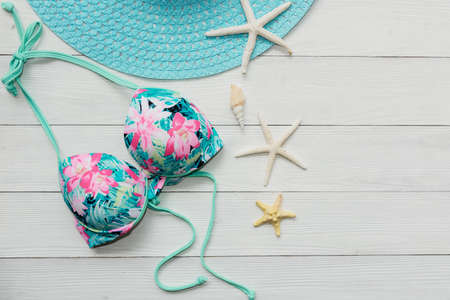 Summer items and accessories  traveler woman colorful bikini , camera go to travel plan holiday vacation in the beach. Tropical sea. Unusual top view, Travel and Summertime Concept.の写真素材