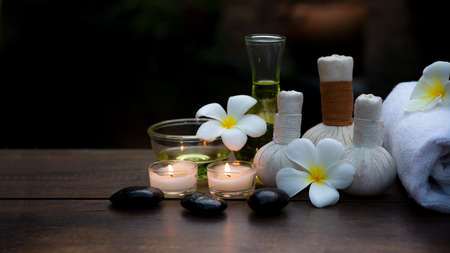 Thai spa massage. Spa treatment cosmetic beauty. Therapy aromatherapy for care body women with candles for relax wellness. Aroma and salt scrub setting ready healthy lifestyle.の写真素材