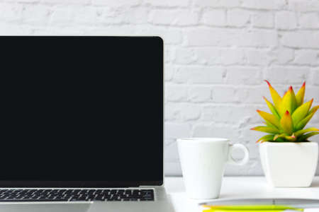 Take Care for healthy life office.  Drink hot Coffee white cup for relax and take a break with laptop background.  Lifestyle Health Conceptの写真素材