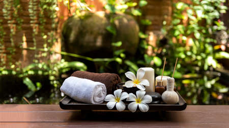 Spa beauty massage healthy wellness background. Spa Thai therapy treatment aromatherapy for body woman with flower Plumeria nature candle for relax summer time. Lifestyle and Cosmetic Conceptの写真素材