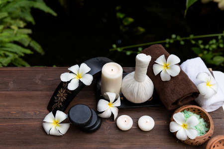 Spa beauty massage healthy wellness background. Spa Thai therapy treatment aromatherapy for body woman with flower Plumeria nature candle for relax summer time. Lifestyle and Cosmetic Conceptの写真素材