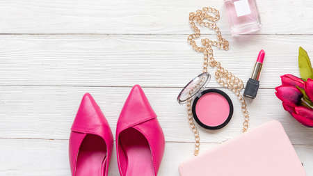 Fashion bag and shoe woman accessories pastel background. Trendy fashion luxury handbag, shoe, perfume and cosmetic design. Lifestyle and Beauty Conceptの写真素材