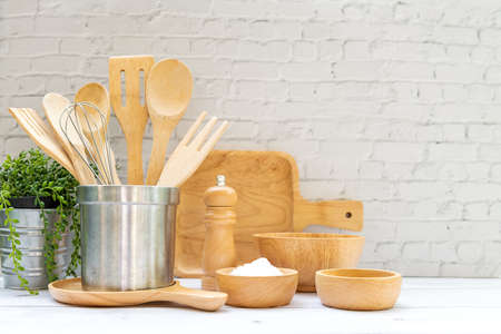 Kitchen tools and kitchenware utensil object with ingredients on kitchen shelf wood white for healthy eat and health care life.  Wall white brick background, copy space for textの写真素材