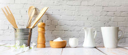 Kitchen tools and kitchenware utensil object with ingredients on kitchen shelf wood white for healthy eat and health care life.  Wall white brick background, copy space for textの写真素材