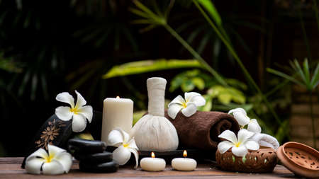 Thai spa massage. Spa treatment cosmetic beauty. Therapy aromatherapy for care body women with candles for relax wellness. Aroma and salt scrub setting ready healthy lifestyle.の写真素材