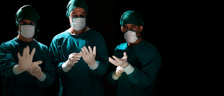 Group and teamwork of surgeons in the hospital operating room. Teamwork medical doctor working  performing surgeryの写真素材