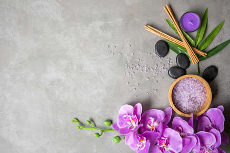 Thai Spa Treatments aroma therapy salt and sugar scrub massage with purple orchid flower on backboard with candle. Thailand. Healthy Conceptの写真素材