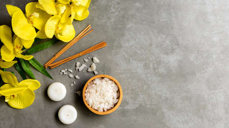 Thai Spa.  Hot stones setting for massage treatment and relax with yellow orchid on blackboard.  Lifestyle Healthy Concept,  copy space for banner, top viewの写真素材