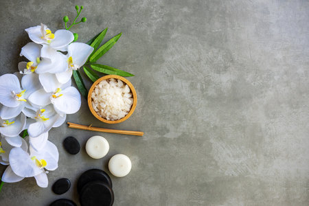 Thai Spa.  Massage spa and hot stones setting for treatment and relax with white orchid on blackboard.  Lifestyle Healthy Concept,  copy space for banner, top viewの写真素材