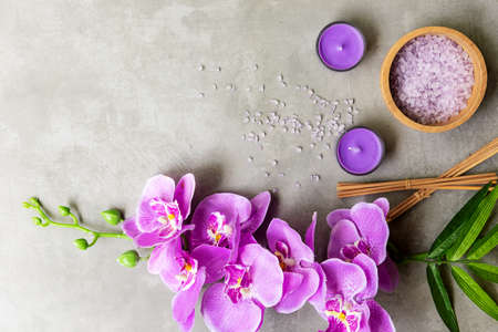 Thai Spa Treatments aroma therapy salt and sugar scrub massage with purple orchid flower on backboard with candle. Thailand. Healthy Concept.の写真素材