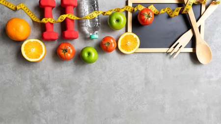 Diet Health eat and food for lifestyle health concept. Sport exercise workout and fresh fruit and measuring tape with backboard for fitness style. Nutrition Healthy Lifestyle Concept, Top view and copy spaceの写真素材