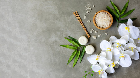 Relax Thai Spa.  Massage spa and hot stones setting for treatment and relax with white orchid on blackboard.  Lifestyle Healthy Concept,  copy space for banner, top viewの写真素材