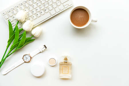 Makeup beauty cosmetic fashion in office. Cosmetics woman working with keyboard and bag product facial make up, hot coffee on white background. Lifestyle fashion Gift Concept, top view, copy spaceの写真素材