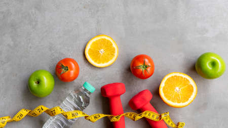 Diet Health eat and food for lifestyle health concept. Sport exercise workout and fresh fruit and measuring tape with backboard for fitness style. Nutrition Healthy Lifestyle Concept, Top view and copy spaceの写真素材