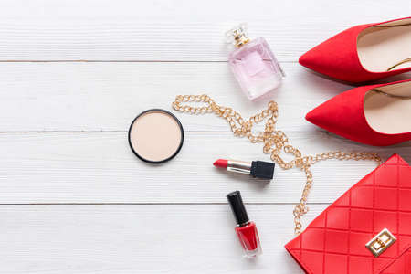 Fashion and beauty.  Fashion red bag and shoe woman accessories pastel background. Trendy fashion luxury handbag, shoe, perfume and cosmetic designの写真素材