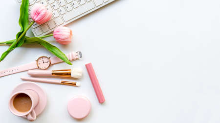 Stay beauty. Makeup beauty cosmetic fashion in office. Cosmetics woman working on laptop with bag product facial and coffee on white background. Lifestyle fashion Gift Concept, top view copy space