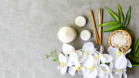 Thai Spa.  Massage spa and hot stones setting for treatment and relax with white orchid on blackboard.  Lifestyle Healthy Concept,  copy space for banner, top viewの写真素材