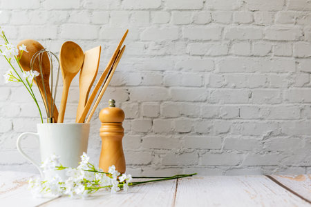 Kitchen tools and kitchenware utensil object on kitchen shelf wood white for healthy eat and health care life.  Wall white brick background, copy space for textの写真素材