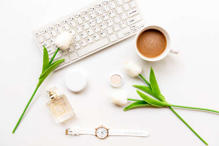Makeup beauty cosmetic fashion in office. Cosmetics woman working with keyboard and bag product facial make up, hot coffee on white background. Lifestyle fashion Gift Concept, top viewの写真素材