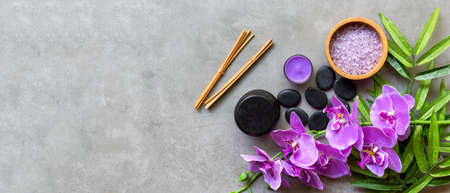 Thai Spa Treatments aroma therapy salt and sugar scrub massage with purple orchid flower on backboard with candle. Thailand. Healthy Concept. copy space for banner, top viewの写真素材