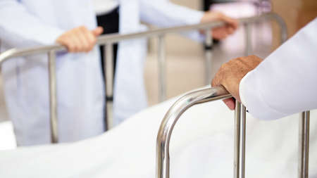 Close up hand Team doctor explaining and discuss symptoms to patient at hospital. Health Care Concept.の写真素材