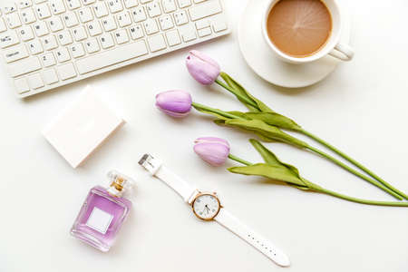 Stay beauty. Makeup beauty cosmetic fashion in office. Cosmetics woman working on laptop with bag product facial and coffee on white background. Lifestyle fashion Gift Concept, top viewの写真素材