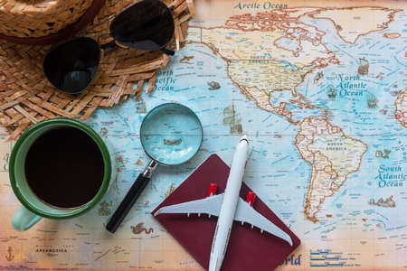 Top view of Traveler accessories items man and camera with tourism backpack and visiting for planning trips travel destination and vacations on the world, copy space.  Travel and Summer holiday conceptの写真素材