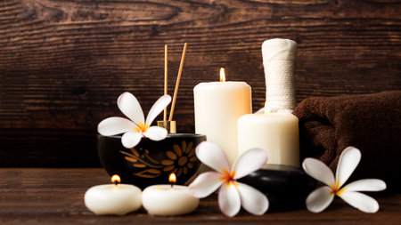 Thai spa massage. Spa treatment cosmetic beauty. Therapy aromatherapy for care body women with candles for relax wellness. Aroma and salt scrub setting ready healthy lifestyle.の写真素材