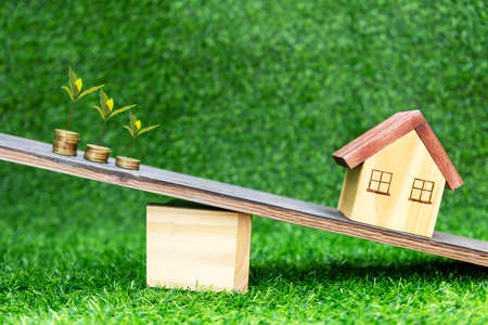 Life balance. Investor of real estate.  The investment for life balance and insurance home.  Â Investment mortgage fund finance and interest rate home loan, green nature background. Investment Conceptの写真素材