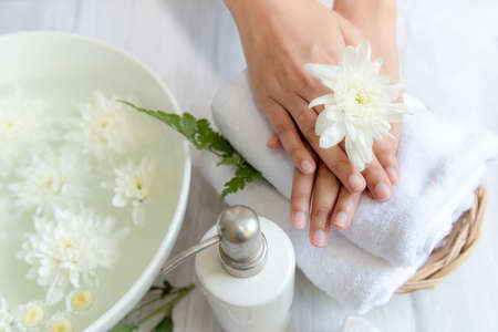 Soft and select focus. Spa beauty massage health wellness.  Spa Thai therapy treatment aromatherapy for nail and hands woman with white flower nature candle for relax and summer time.Â  Lifestyle and cosmetic Conceptの写真素材